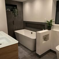 Freestanding bath with floating vanity