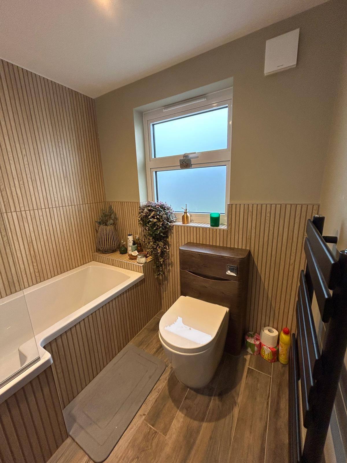 Wood slat bath and toilet with window