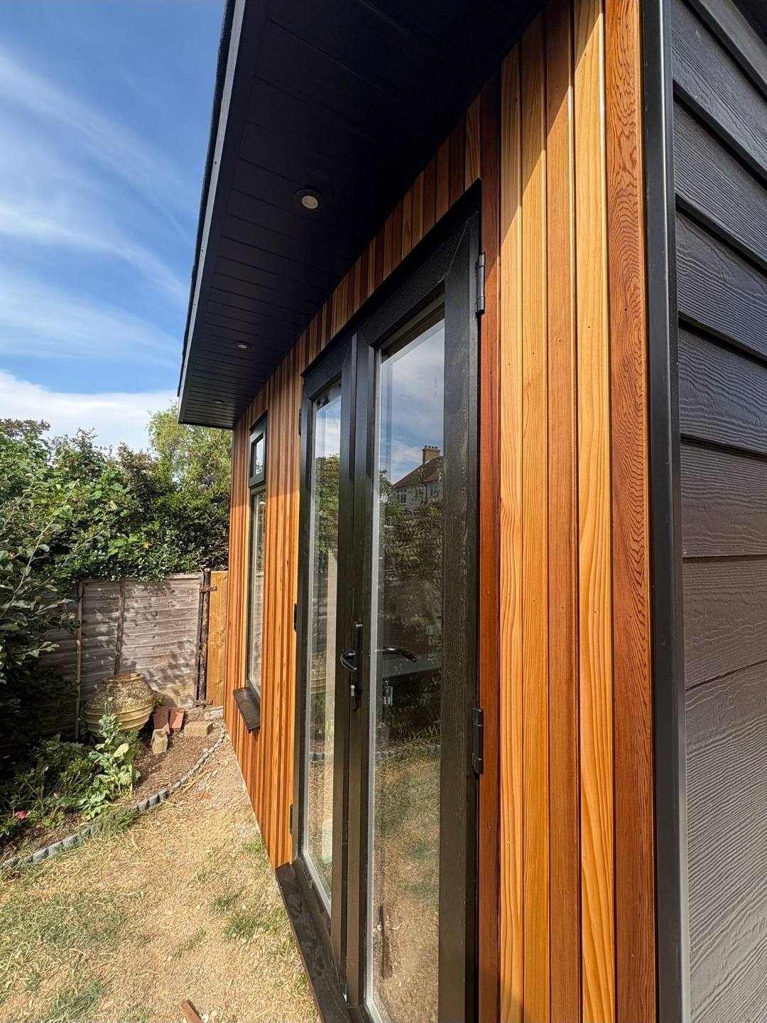 Garden room cedar cladding and glazed door detail