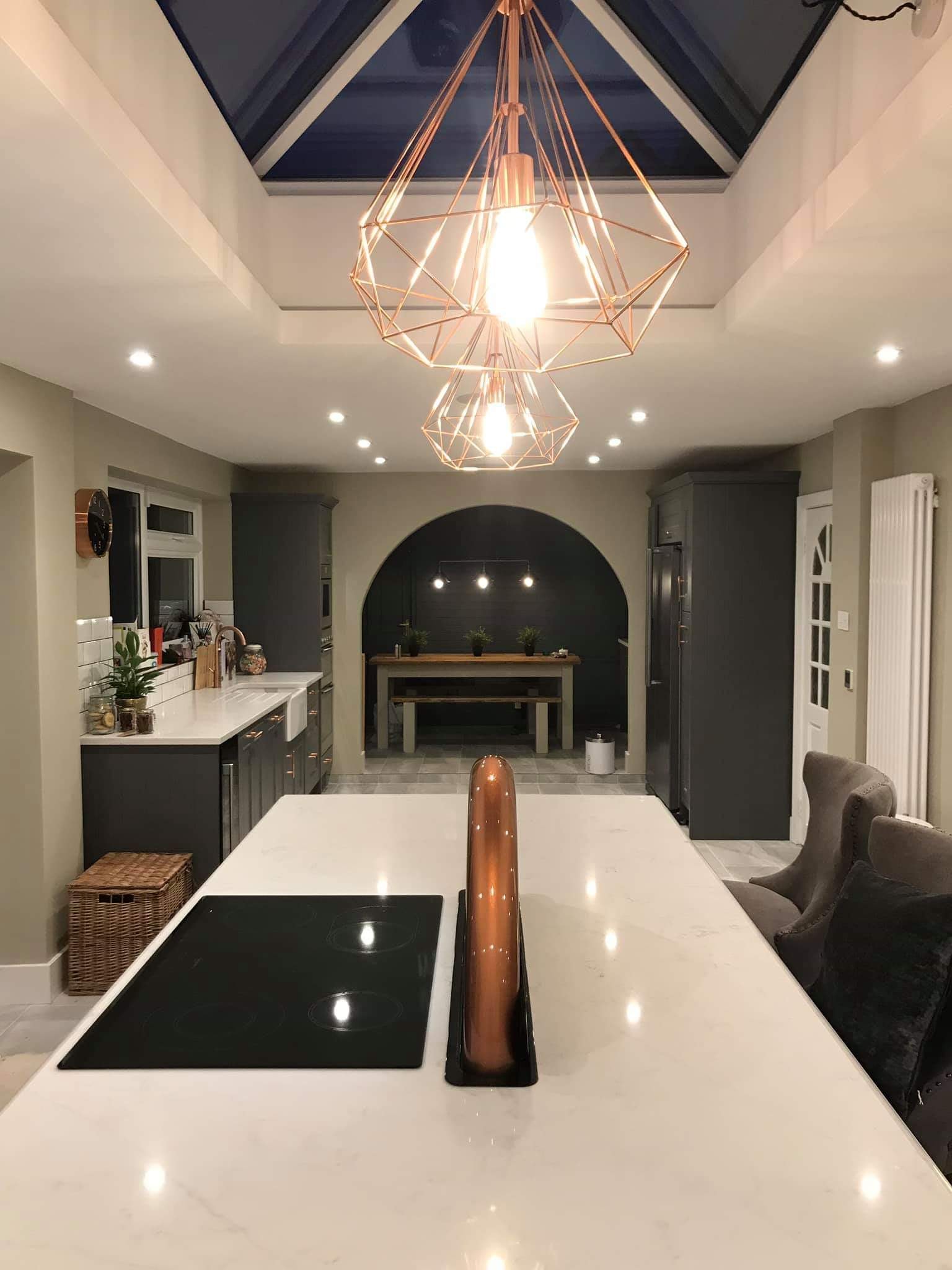 Lantern ceiling kitchen with island and arched alcove